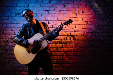 acoustic guitar player on stage