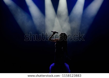 Singer in silhouette