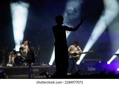 singer silhouette in stage lights live concert