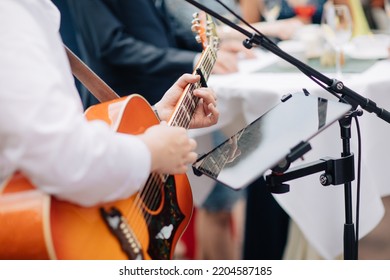 Singer Sings On The Guitar Outside At A Wedding. Wedding With Live Music. Music For Private Events	
