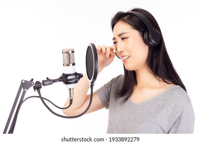 Singer Woman Singing Sad Song Or Broken Heart Song In Recording Studio, Using Microphone, Pop Filter For Recording Music Singer Woman Crying And Into Song At Music Studio Isolated On White Background