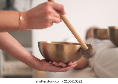 Singing Bowls In Sound Healing Therapy With Two Women 