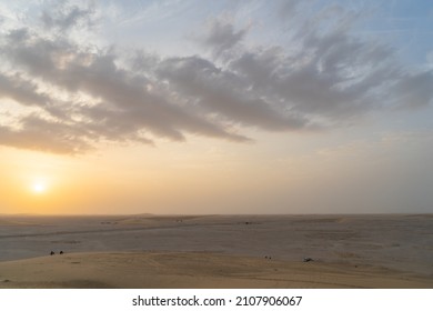 Singing Sand Dune In Qatar During Sunset.