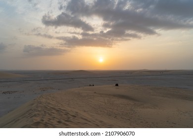 Singing Sand Dune In Qatar During Sunset.