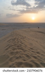 Singing Sand Dune In Qatar During Sunset.