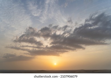 Singing Sand Dune In Qatar During Sunset.