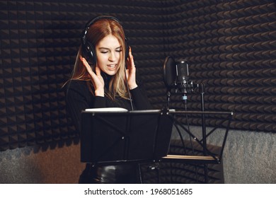 Singing and working in a studio with a microphone