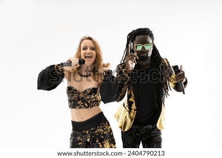 singing young modern couple african man and caucasian woman with microphones