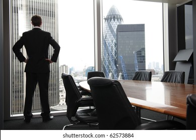 Single adult business man waiting for meeting to begin in Board room - Powered by Shutterstock