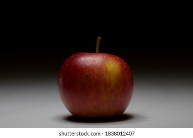 Single apple with moody lighting and space for text