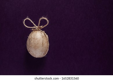 A Single Aster Egg Decorated With Crafty Paper And Ribbon On The Dark Background