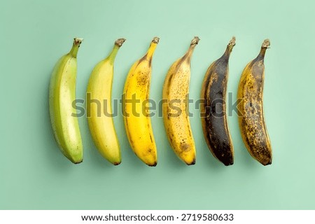 A single banana split into five sections, each showing a different stage of ripeness