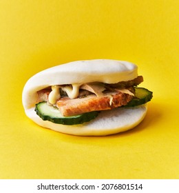  Single bao bun on a yellow background