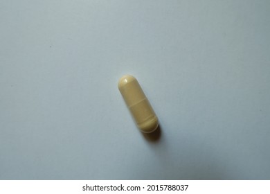 Single Beige Capsule Of Milk Thistle Extract From Above