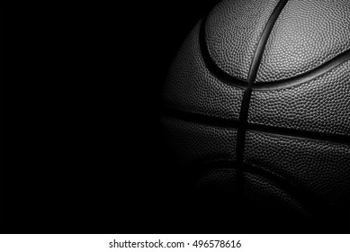 Single black Basketball on a black background.