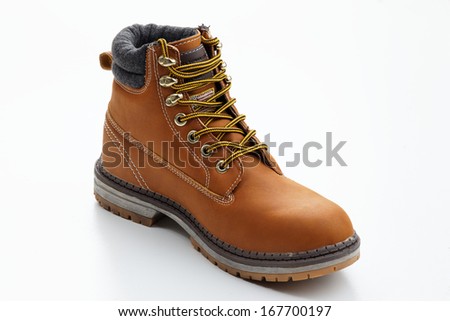 Single black boot isolated over white background. Clipping path included.No brand Stock photo © 