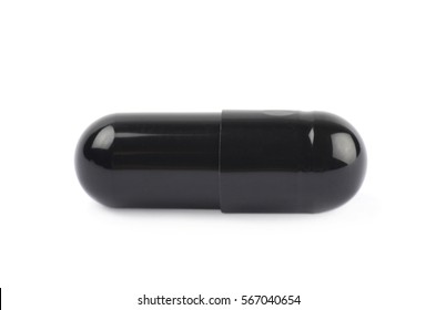 Single black softgel capsule pill isolated over the white background