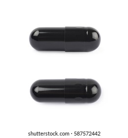 Single black softgel capsule pill isolated over the white background, set of two different foreshortenings
