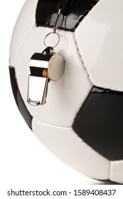 Single Black And White Soccer Sports Ball With Referee Whistle Close Up With Selective Focus Over White Background