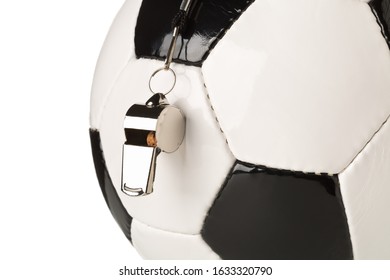 Single Black And White Soccer Sports Ball With Referee Whistle Close Up With Selective Focus Over White Background