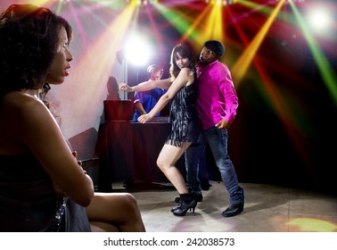 single black woman jealous of interracial couple on dancefloor - Powered by Shutterstock