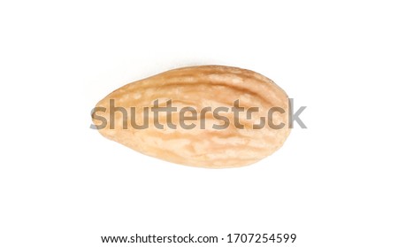 A single blanched almond seed isolated on white background. Diet food