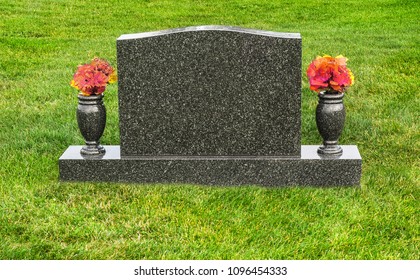 Single blank tombstone with flowers