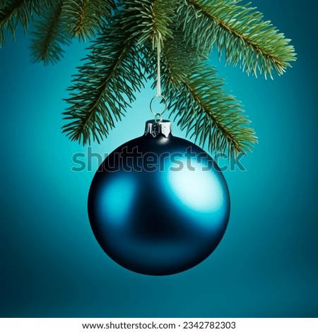 Single Blue Christmas glass ball hanging from a pine branch.