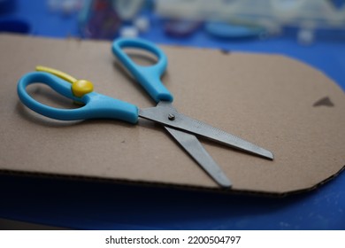 A Single Blue Isolated School Children Supply That Are Used By Small Children In Classes On Handmade Arts Laying On A Thick Paper Plate