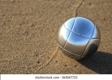 Single Bocce Ball On Sandy Beach