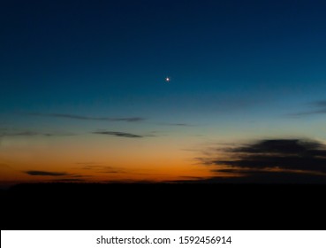 A Single Bright Star On A Colorful Night Or Morning Sky 