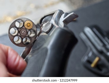 A Single Bullet Placed In A 38 Caliber Revolver Handgun.