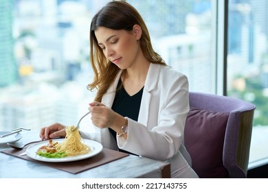 Single Businesswoman Is Eating Lanch With Spagetti Disk On Rooftop Restaurant , Happy Face Meal.