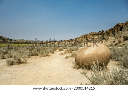 Single Cannonball Concretion Sits Along Dusty Trail Into Theodore Roosevelt National Park