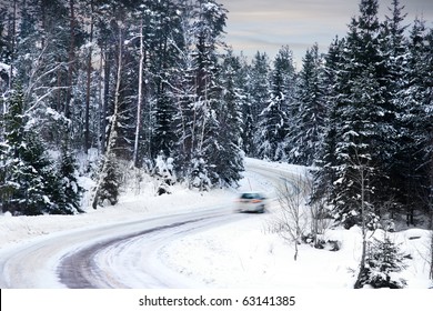  Single Car Driving Along A A Winter Road