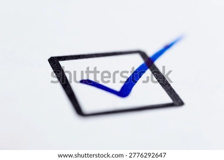 Single check mark on a white paper.