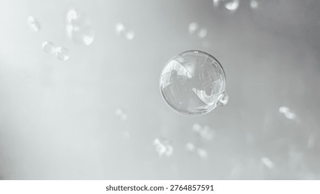 a single clear soap bubble floating in the air