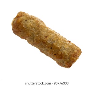 A Single Cooked Breakfast Sausage On A White Background.