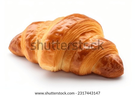 Single croissant closeup, isolated on white background. Fresh baked croissant closeup photo.