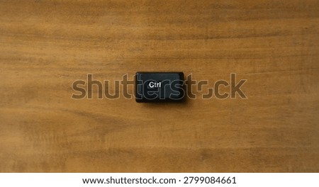 Single Ctrl Keyboard Key Concept On Wooden Surface Background