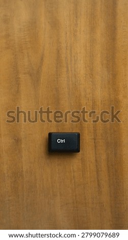 Single Ctrl Keyboard Key On Wooden Background With Copy Space