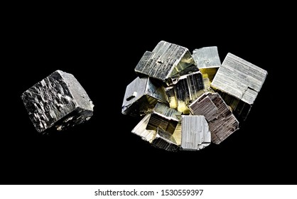 A Single Cube And A Aggregate Pyrite Stones Together Against A Black Limbo Background. Focus Stacking Macro Shooting