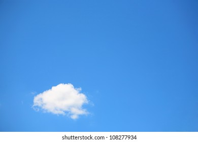 Single Cumulus Cloud On A Blue Sky