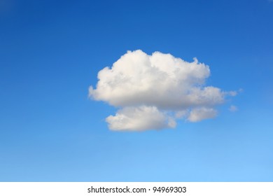 Single Cumulus Cloud On A Blue Sky