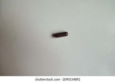 Single Dark Purple Capsule Of Bilberry Extract Dietary Supplement