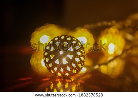 single decorative light blurred for dramatic effect 