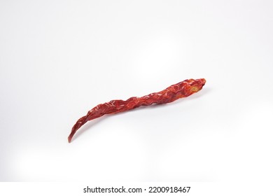 A Single Dried Chili Isolated On White Background