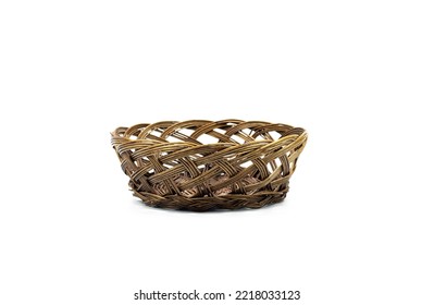 Single empty brown wicker basket isolated on white background, front view. New brunette pannier basketry circle handmade, be put the bread and fruit in home. studio shooting