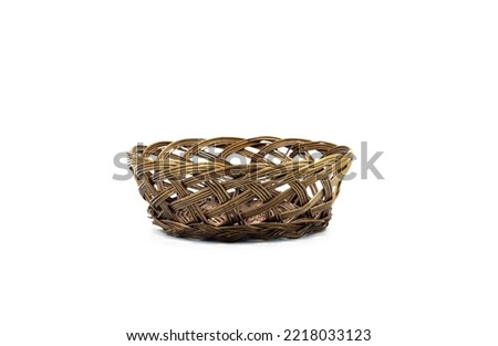 Single empty brown wicker basket isolated on white background, front view. New brunette pannier basketry circle handmade, be put the bread and fruit in home. studio shooting