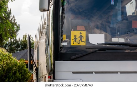 Single Empty Modern School Trip Bus, Kids Transport Designated Coach Vehicle Detail, Closeup, Nobody, Frontal Shot. Children Journey Safety Concept. Traffic, Transportation, Means Of Transport